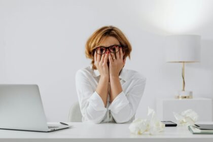 Woman stressed at desk - lower cortisol naturally