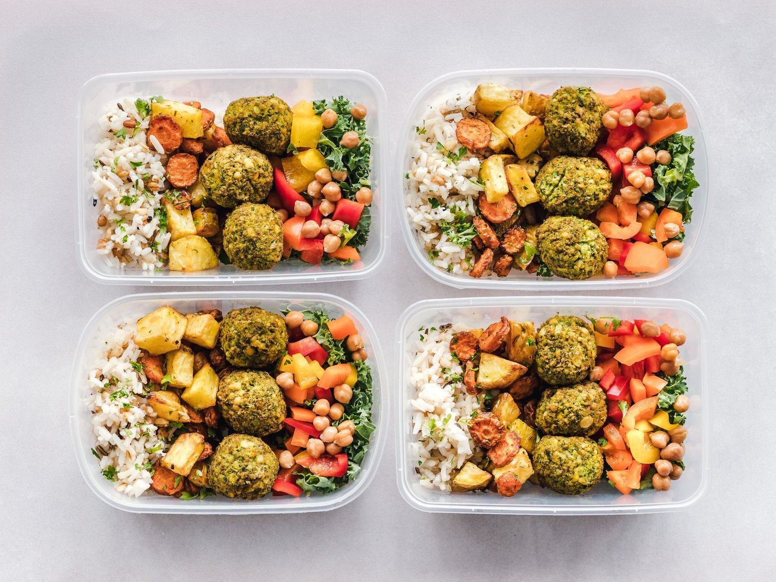 Prepped high-protein meal containers arranged neatly on a kitchen counter.
