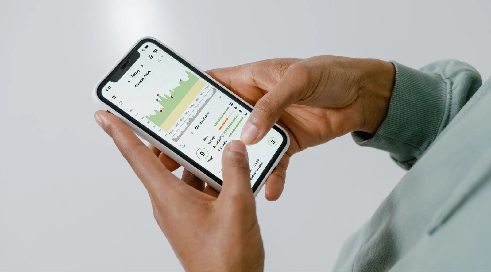 Smartphone displaying a graphical bar path and velocity curve during a deadlift.