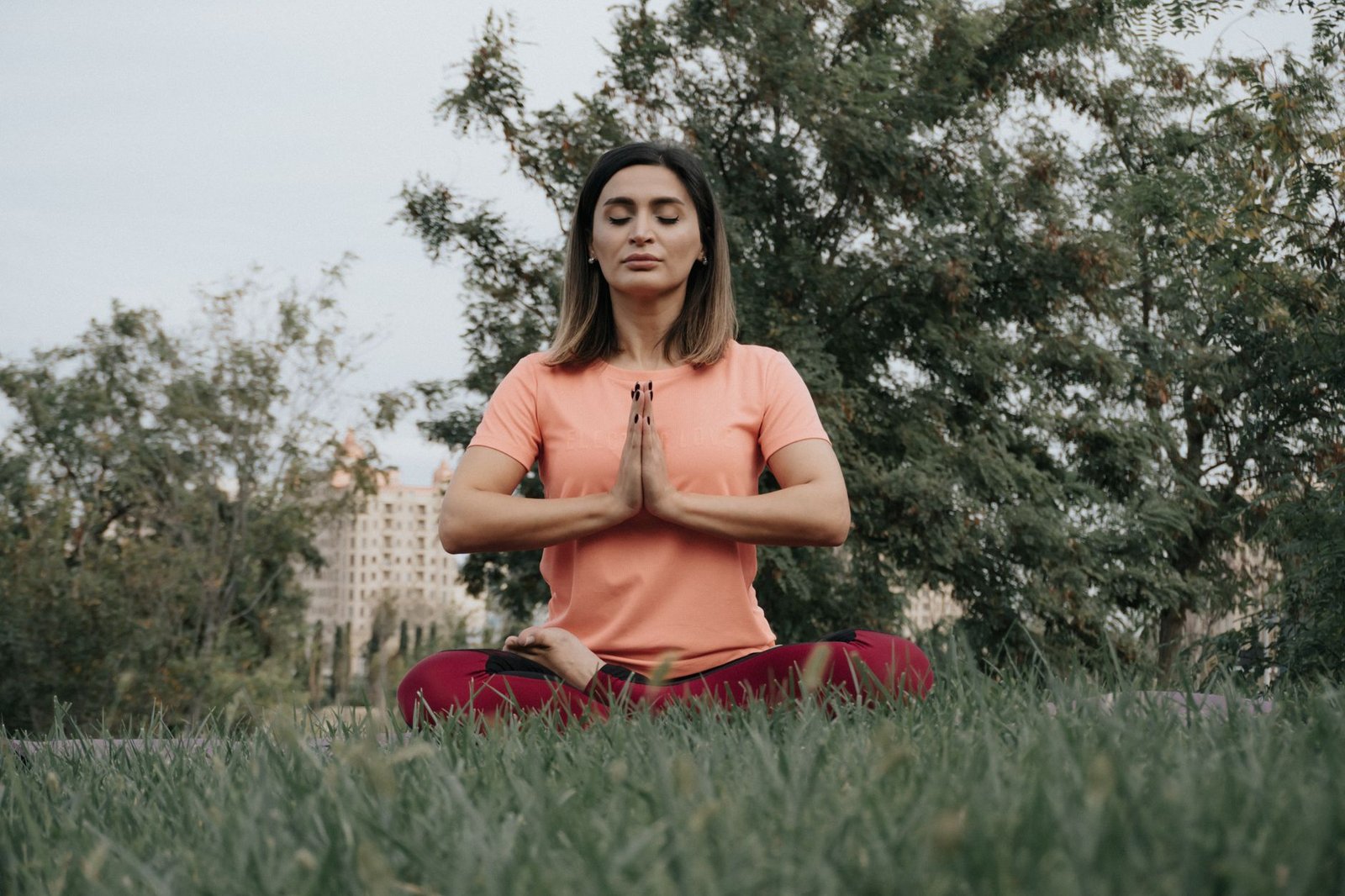 Woman practicing calm breathing exercises in a tranquil room.