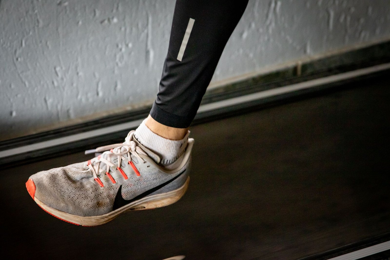 Professional athlete performing high-intensity interval training on a specialized treadmill.