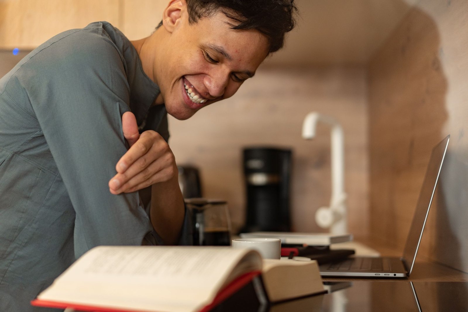 A professional engaged in video call while walking gently on an under-desk treadmill.