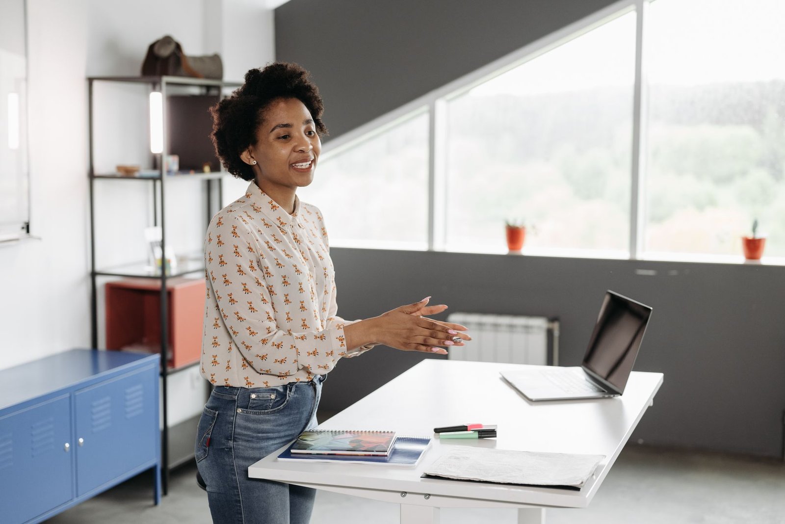 Professional reviewing data at a modern ergonomic sit-stand workstation.