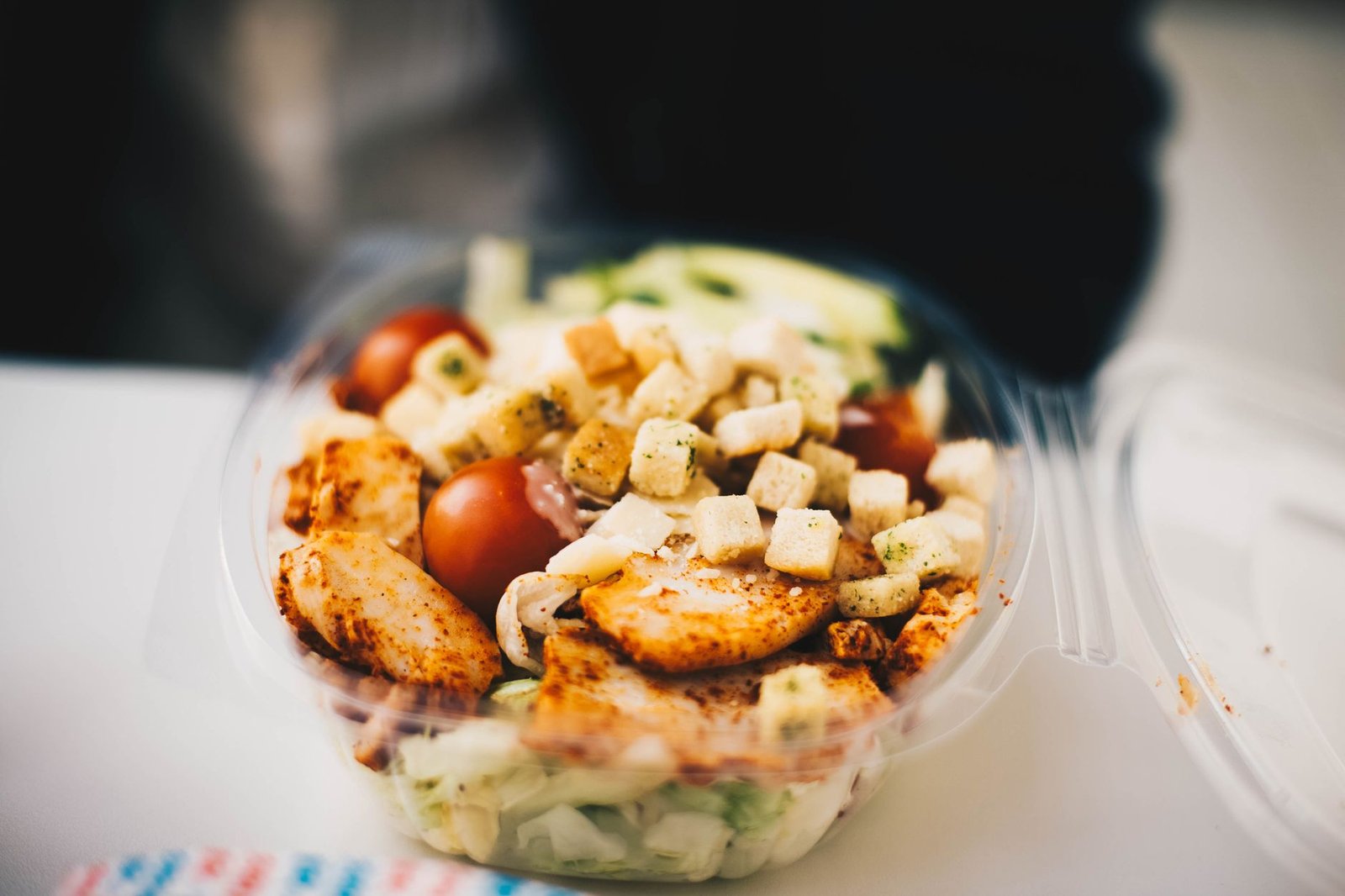 Balanced high protein meal prep containers with lean meats and vegetables.