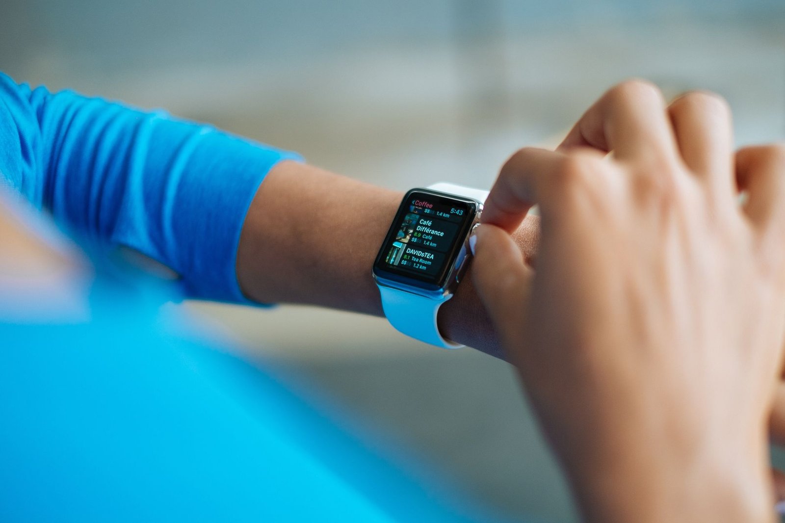 Professional analyzing fitness data and biometric metrics on a digital tablet.
