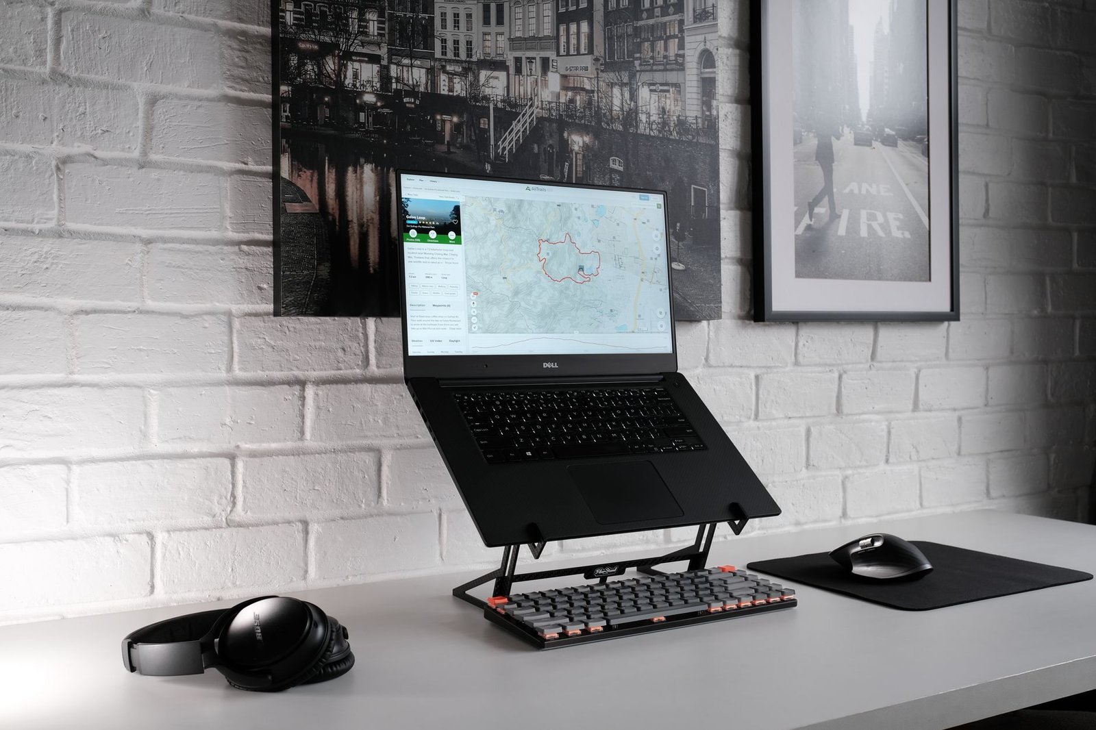 Professional working on a laptop while using an under-desk walking pad.
